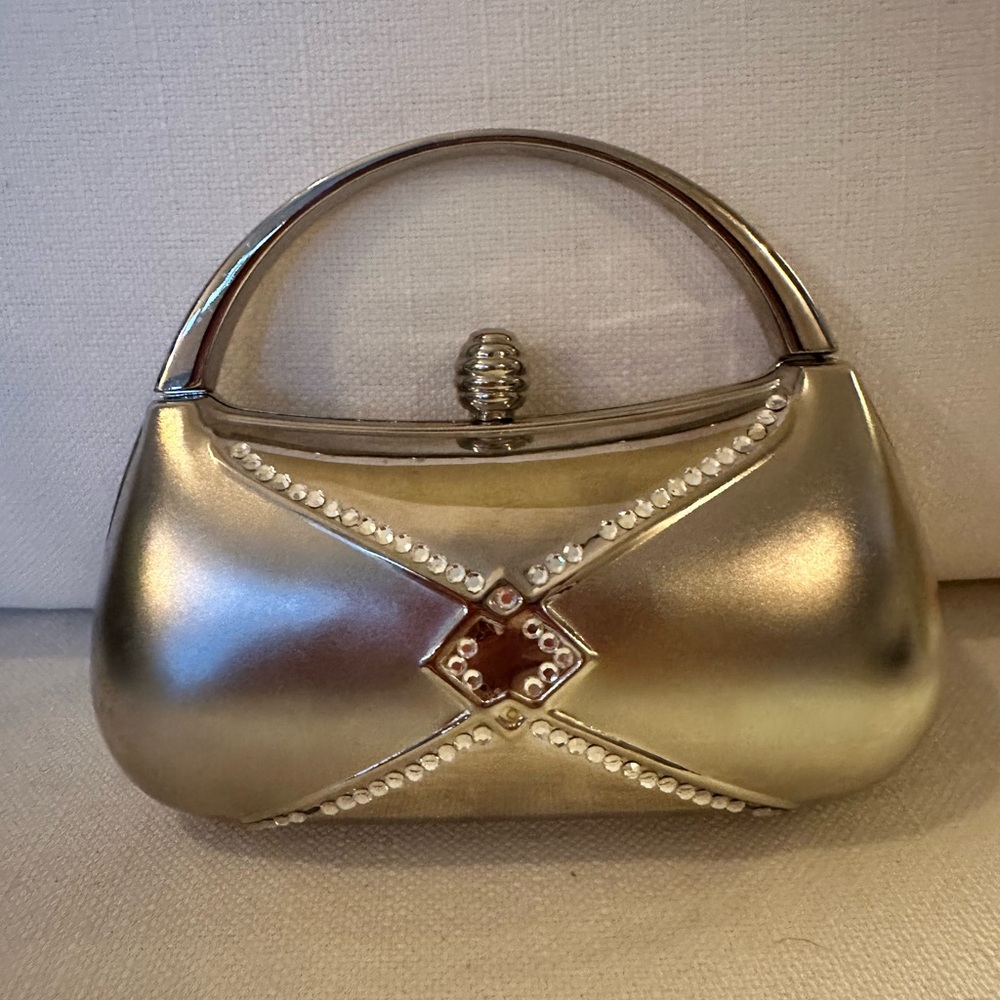 VINTAGE SILVER METAL CLUTCH WITH STRAP AND STONE EMBELLISHMENTS ON FRONT